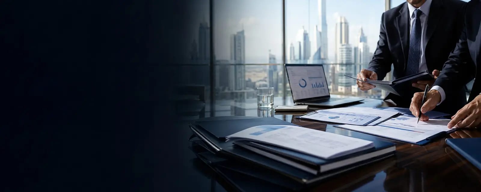 Completed business advisory files in a Dubai boardroom